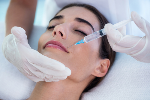 Relaxed woman receiving botox or dysport